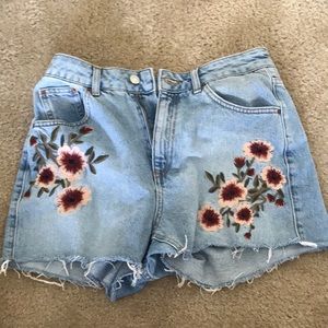 Denim shorts with floral pattern